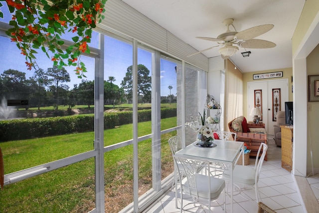 sunroom / solarium with french doors and ceiling fan