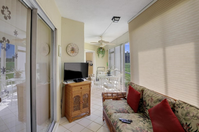 tiled living room featuring ceiling fan