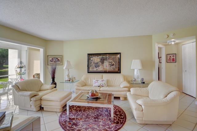 living room featuring light tile patterned floors and a textured ceiling