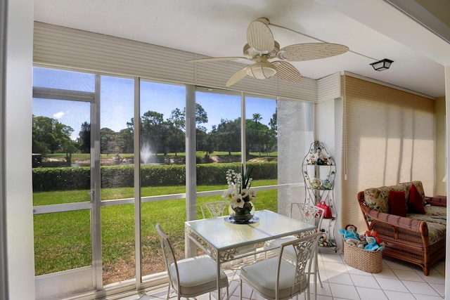 sunroom featuring ceiling fan