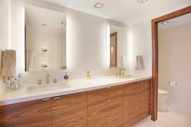 bathroom with vanity and toilet