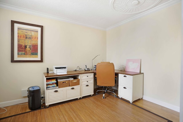 office area with ornamental molding, a textured ceiling, and hardwood / wood-style flooring