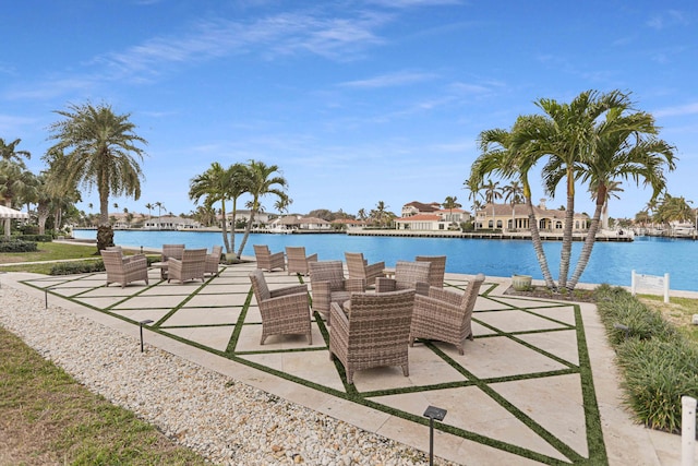 view of patio featuring an outdoor living space and a water view