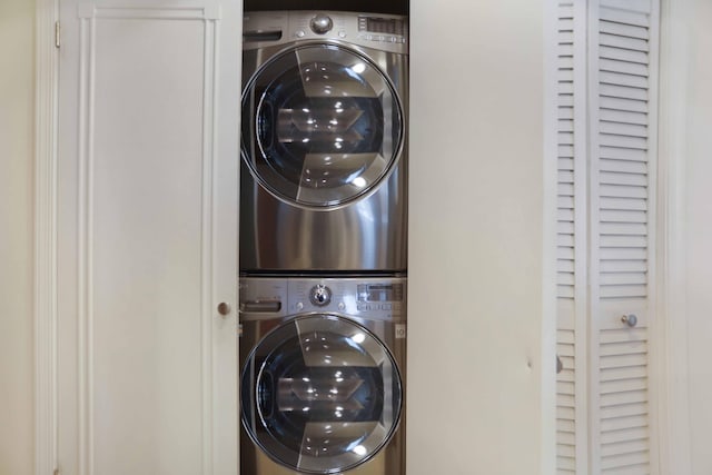 washroom with stacked washer and dryer