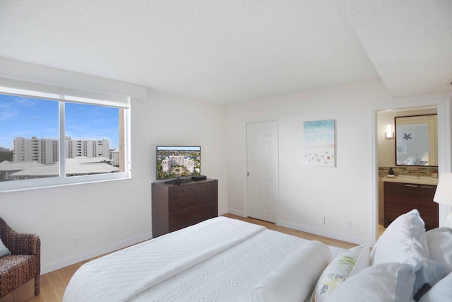 bedroom with light hardwood / wood-style floors