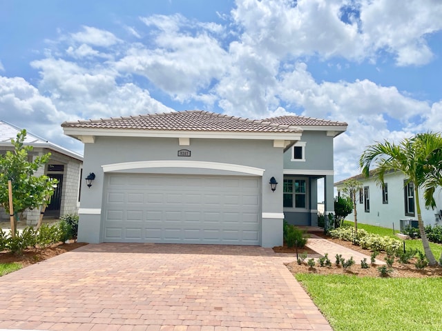 mediterranean / spanish-style home featuring a garage