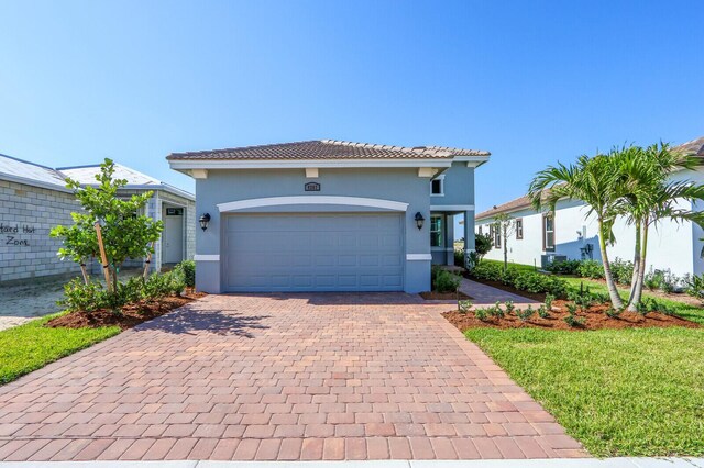 mediterranean / spanish-style house featuring a garage