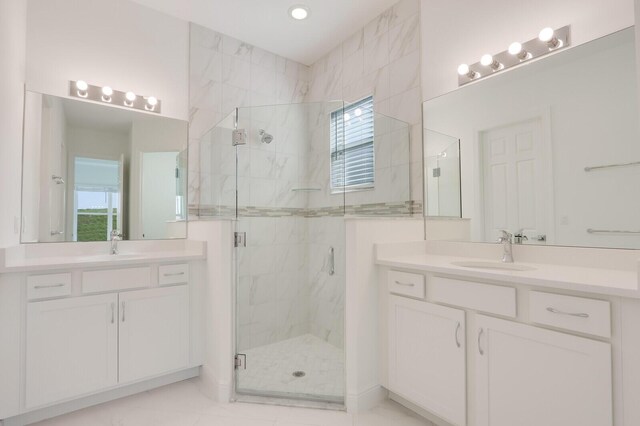 bathroom with vanity and an enclosed shower