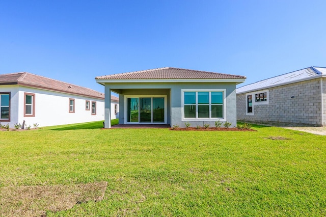 rear view of house with a lawn