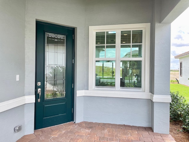 property entrance featuring covered porch