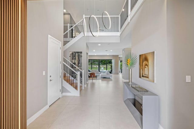 entryway featuring a towering ceiling