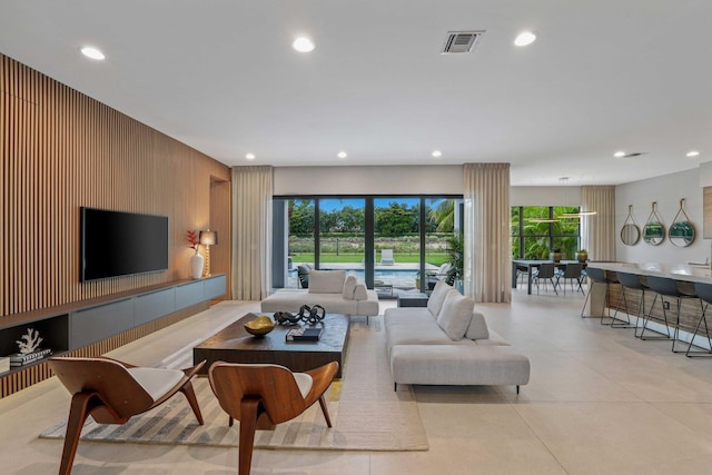 living room with wood walls