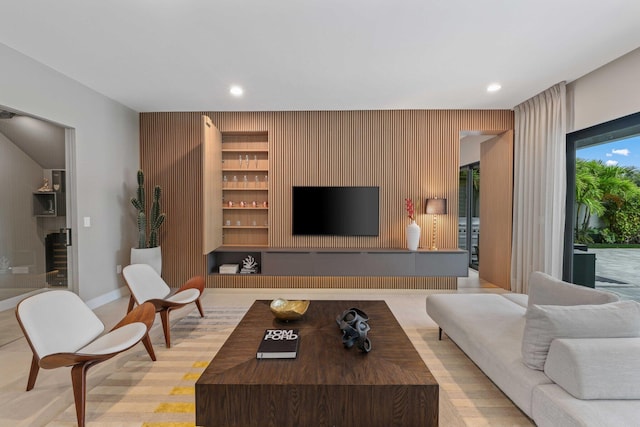 living room with wooden walls