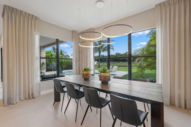 dining area featuring light tile patterned floors