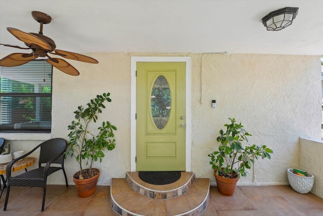 property entrance featuring ceiling fan