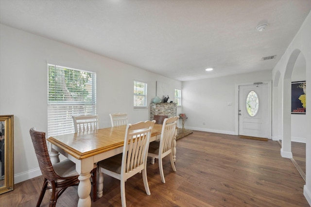 dining area with dark hardwood / wood-style flooring