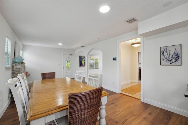 dining area with hardwood / wood-style floors