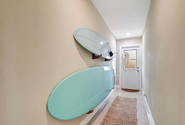 hallway with light tile patterned floors