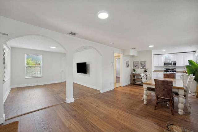 unfurnished dining area featuring light hardwood / wood-style floors