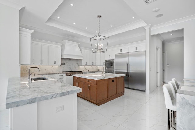 dining area featuring a fireplace, ornamental molding, and a raised ceiling