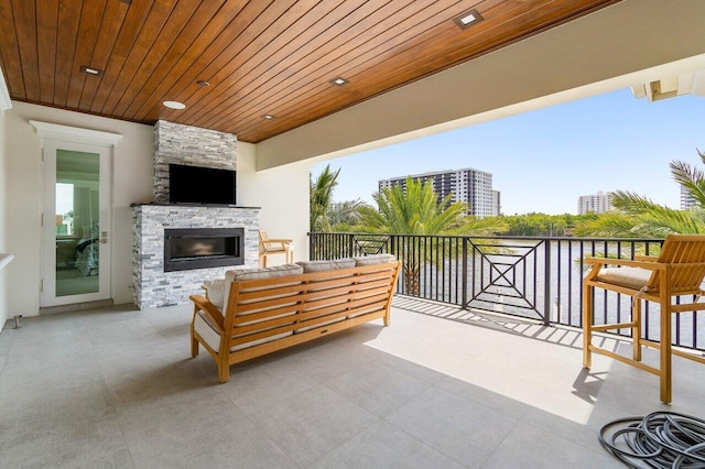 view of patio featuring area for grilling, a grill, sink, and a water view