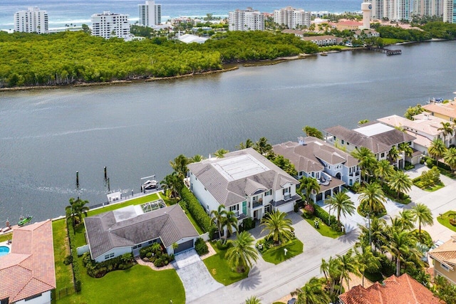 birds eye view of property with a water view