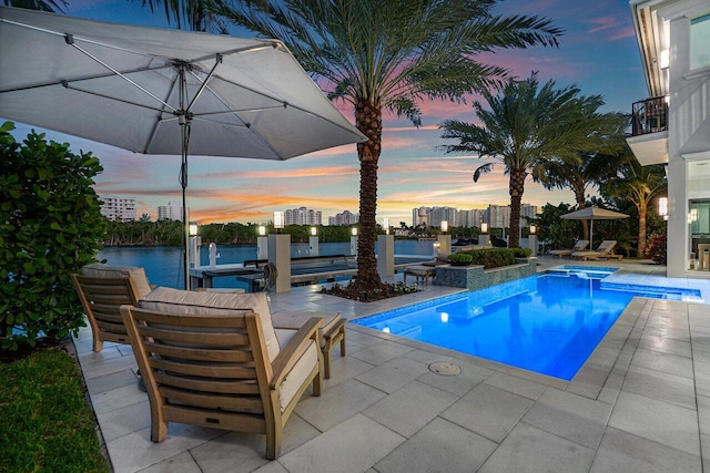 view of pool featuring french doors and a patio