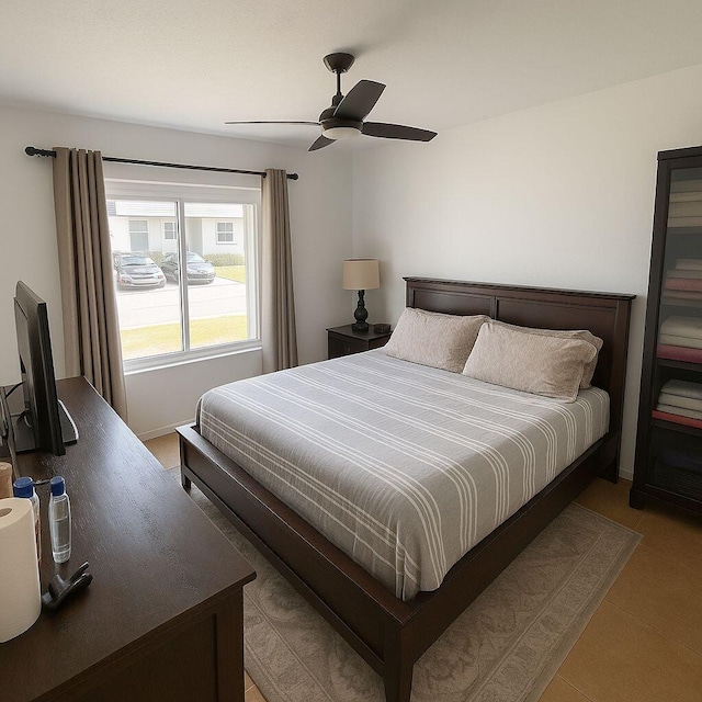 1202 Villa Cir, Boynton Beach, FL 33435 - tiled bedroom featuring ceiling fan