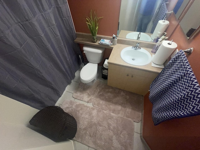 bathroom featuring vanity and toilet