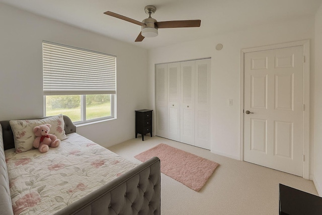 1202 Villa Cir, Boynton Beach, FL 33435 - bedroom featuring light carpet, a closet, and ceiling fan