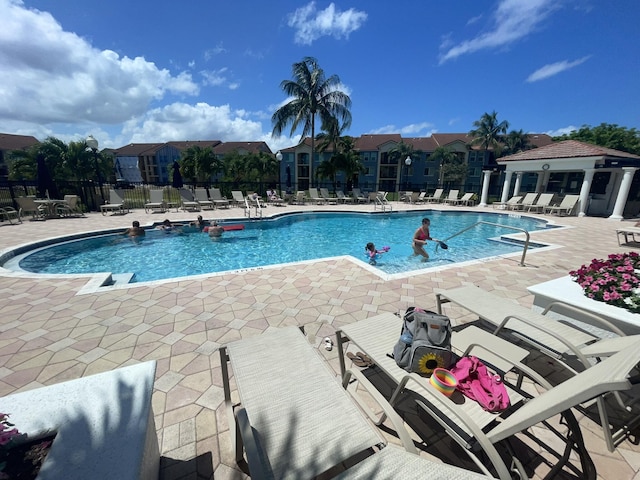 view of swimming pool with a patio