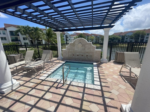 view of pool with a water view, a pergola, a patio, and an in ground hot tub