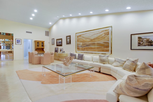 living room featuring a high ceiling