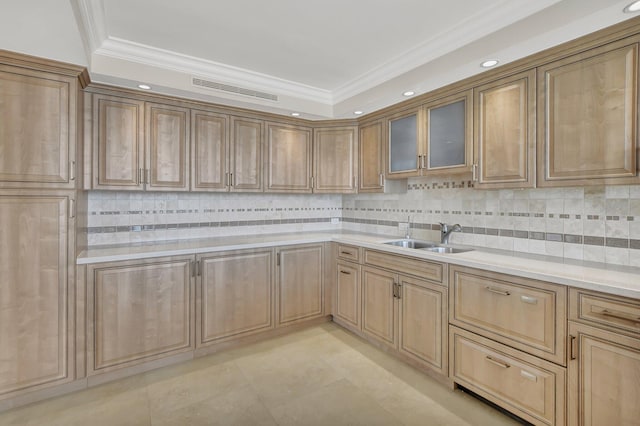 kitchen featuring ornamental molding, sink, and backsplash