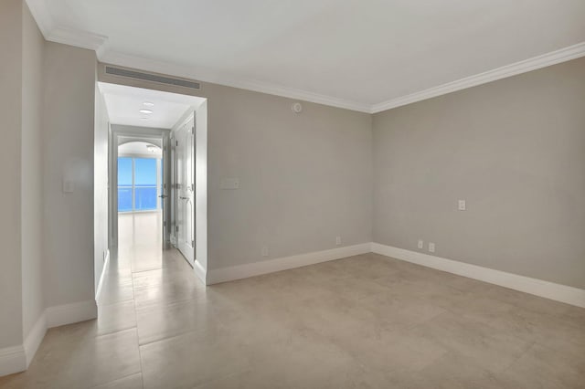 spare room featuring ornamental molding