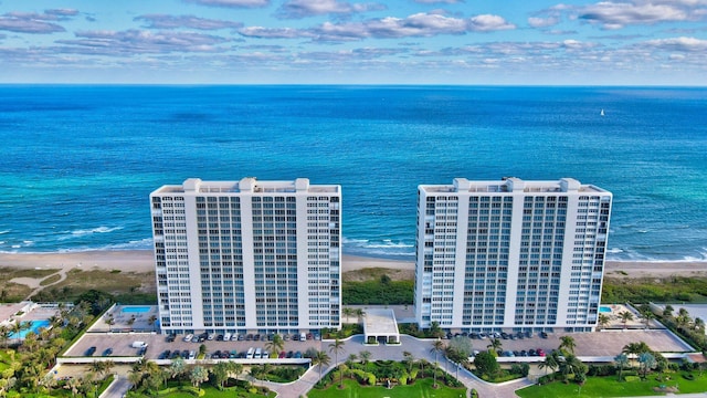 bird's eye view featuring a water view and a view of the beach