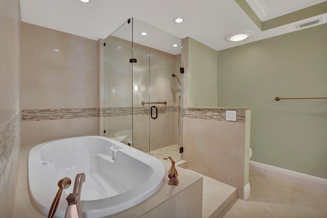 bathroom featuring tile patterned flooring, ornamental molding, and independent shower and bath