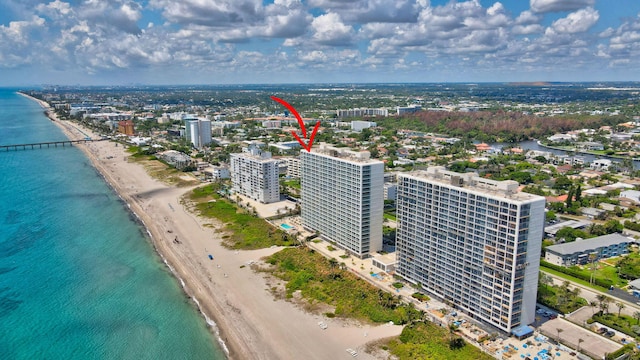 drone / aerial view with a view of the beach and a water view