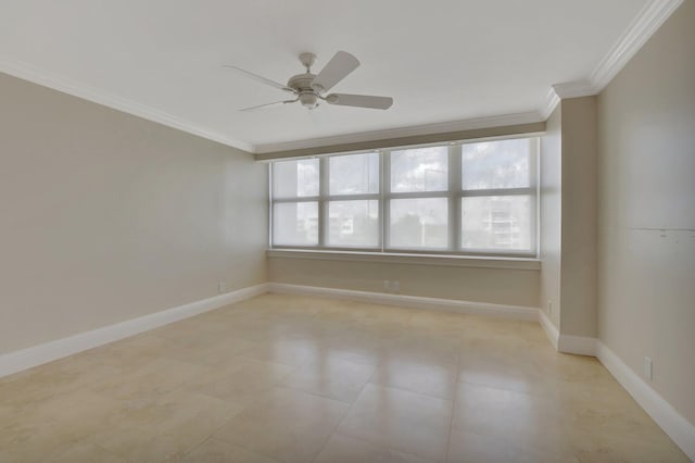 spare room with crown molding and ceiling fan