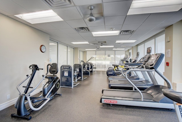 workout area with a paneled ceiling