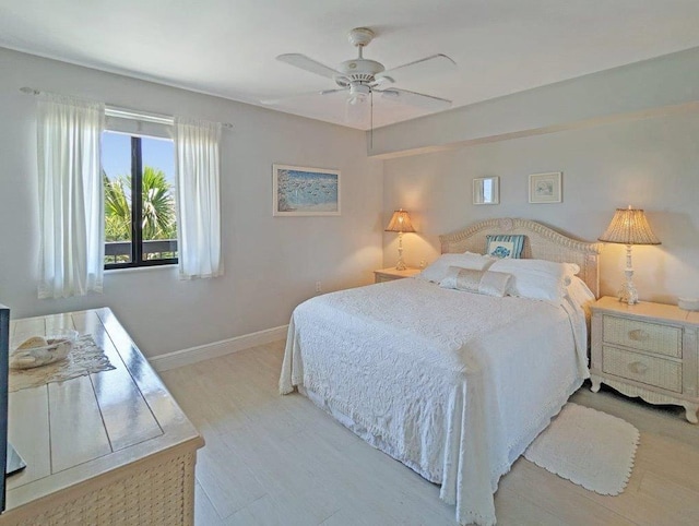 bedroom with ceiling fan and light hardwood / wood-style flooring