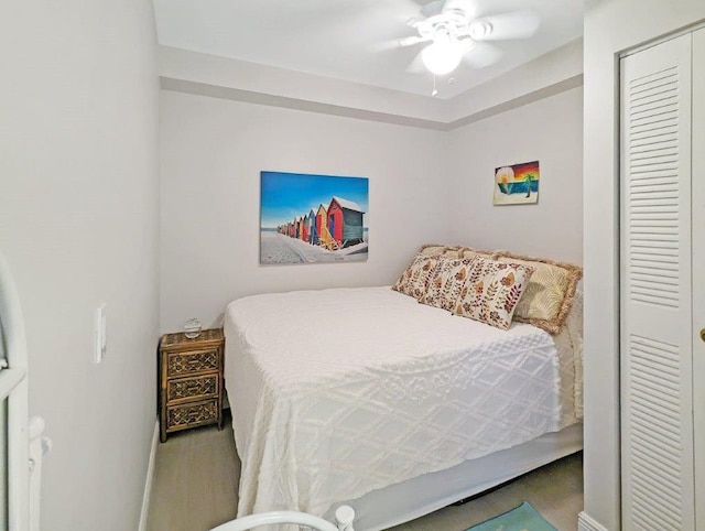 bedroom featuring ceiling fan and a closet