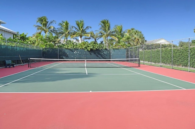 view of sport court with basketball hoop