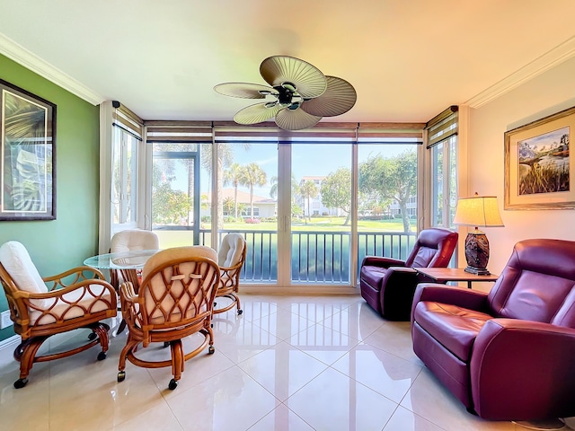 sunroom / solarium featuring plenty of natural light and ceiling fan