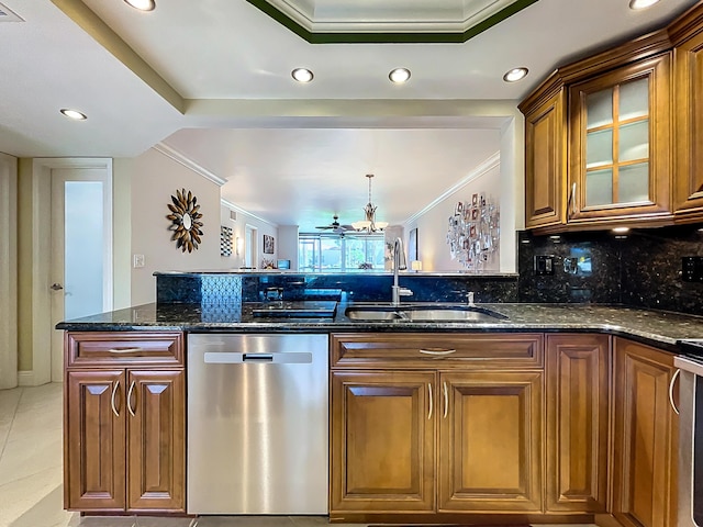 kitchen featuring sink, stainless steel dishwasher, backsplash, dark stone counters, and light tile patterned floors