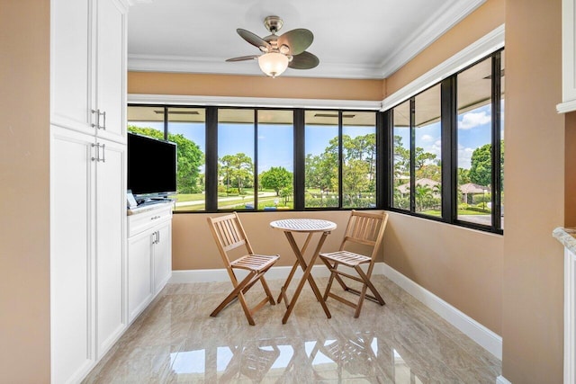 sunroom with ceiling fan and plenty of natural light