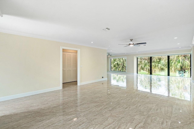 spare room featuring ceiling fan and crown molding