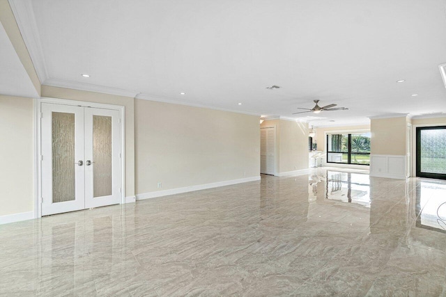 unfurnished living room with ceiling fan, crown molding, and french doors