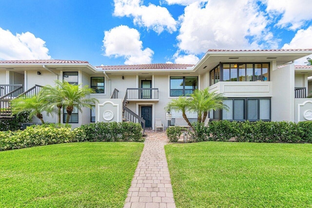 view of front of property with a front lawn