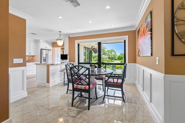 dining room with ornamental molding